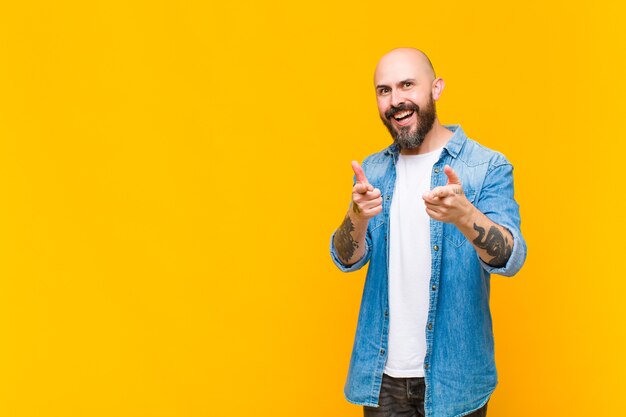 young bald man model expressing a concept 