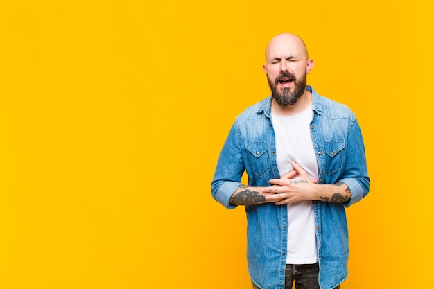 young bald man model expressing a concept 