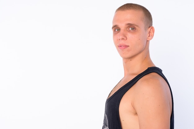  young bald rebellious man isolated against white wall