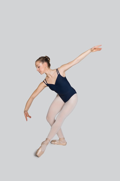 Young ballerina practising ballet moves