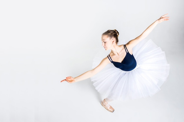 Young ballerina practising ballet moves