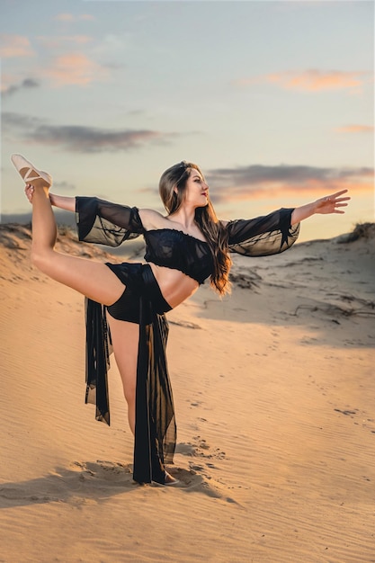 A young ballerina warms up and dances rehearses in the open air High quality photo