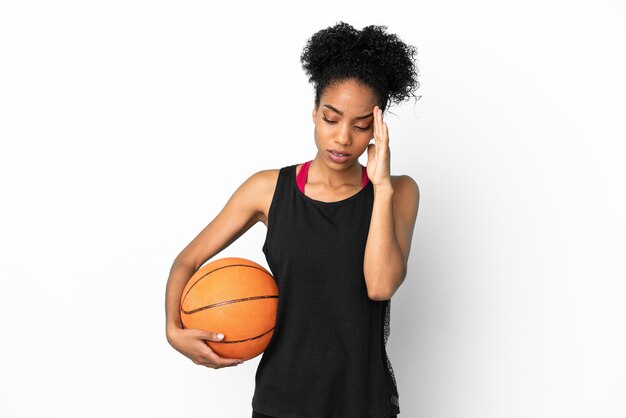 Young basketball player latin woman isolated on white background with headache