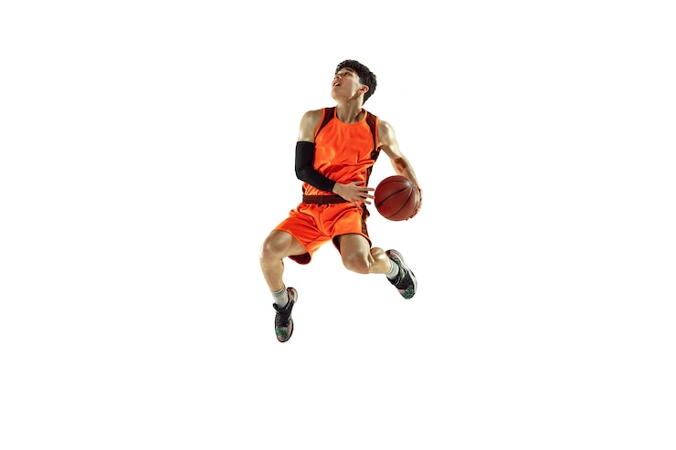 Photo young basketball player training isolated on white studio background