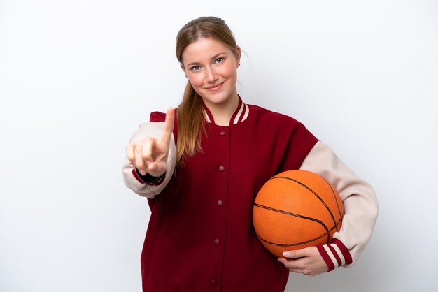 Young basketball player woman isolated on white background showing and lifting a finger