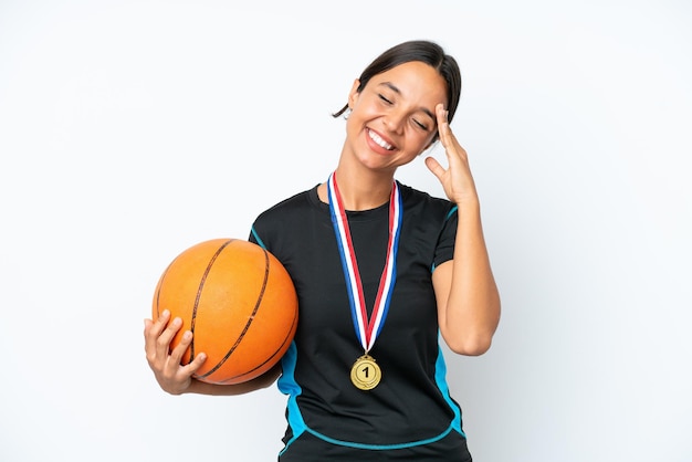 Young basketball player woman isolated on white background smiling a lot