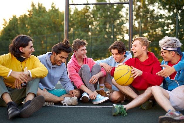 Young basketball players take a break after game