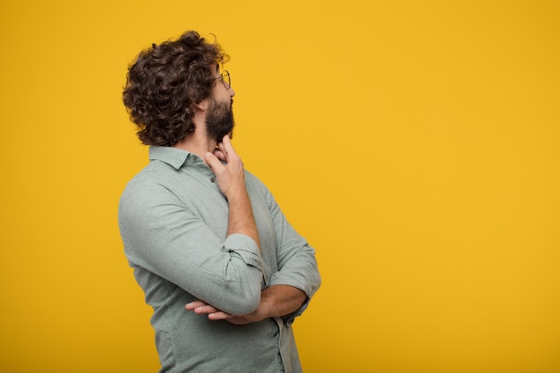 Young bearded businessman expressing a concept 