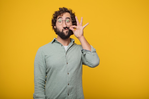 Young bearded businessman expressing a concept