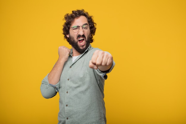 Young bearded businessman expressing a concept 