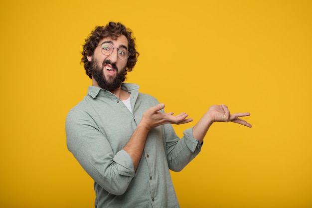 Young bearded businessman expressing a concept 