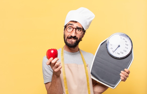 Young bearded chef man doubting or uncertain expression