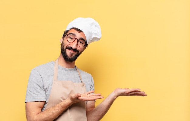 Young bearded chef man happy expression