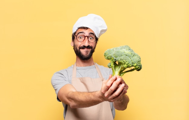 Foto giovane chef barbuto felice espressione