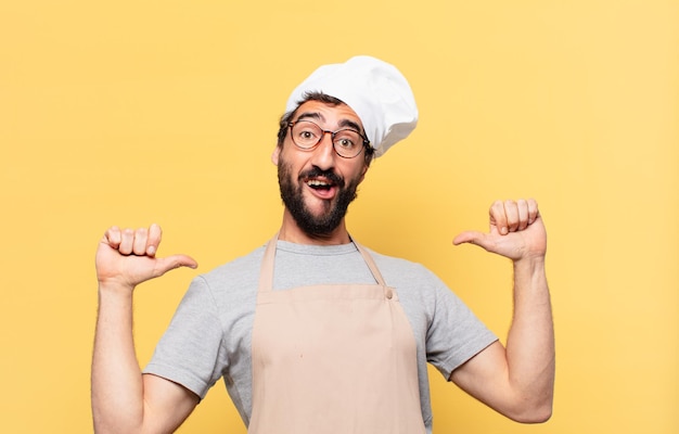 Young bearded chef man happy expression