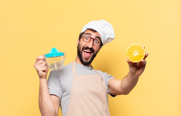 Young bearded chef man surprised expression