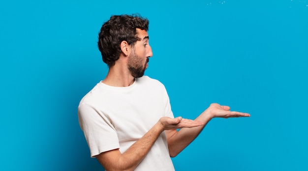 Young bearded crazy man with a copy space