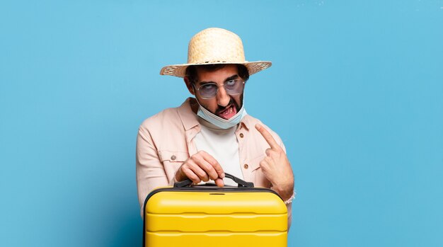 Young bearded crazy man with a covid mask