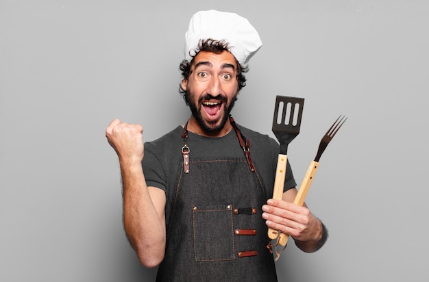 Young bearded man barbeque chef concept