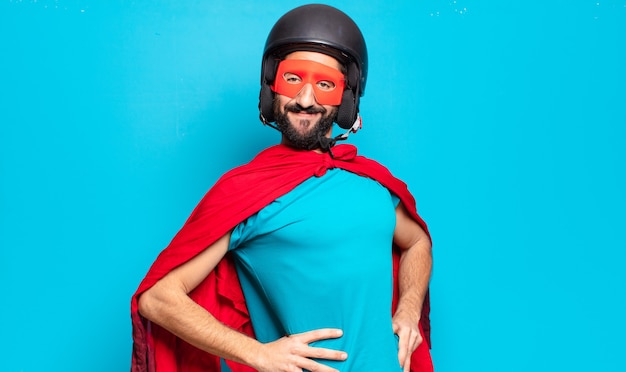 Young bearded man. crazy and humorous super hero with helmet and mask