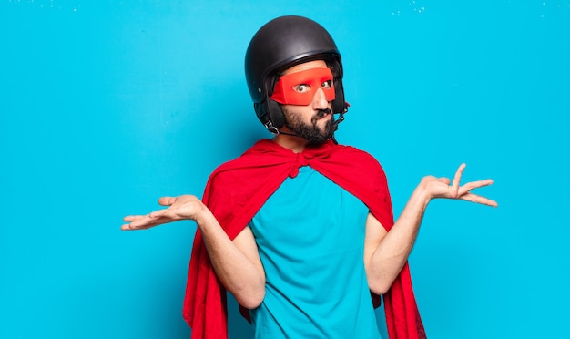 Young bearded man. crazy and humorous super hero with helmet and mask