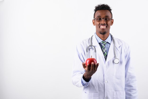 Young bearded man doctor against white