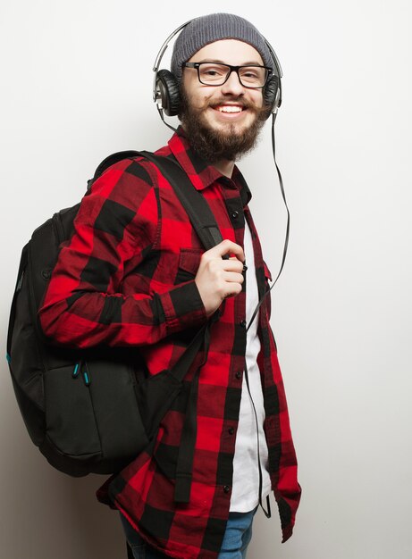 young bearded man listening to music