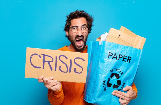 Young bearded man recycling