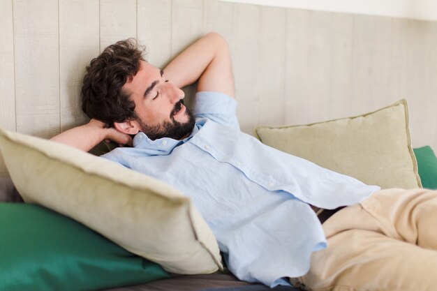 Young bearded man resting at home