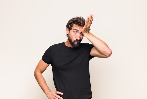 Young bearded man smoking a cigarette