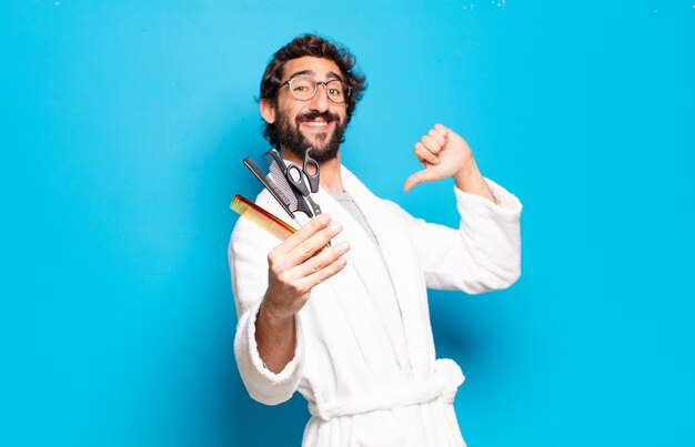 Young bearded man wearing bathrobe. hair or beard care concept