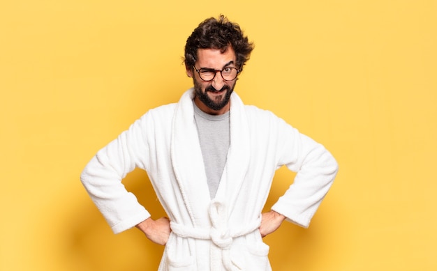 Young bearded man wearing bathrobe