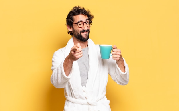 Young bearded man wearing bathrobe