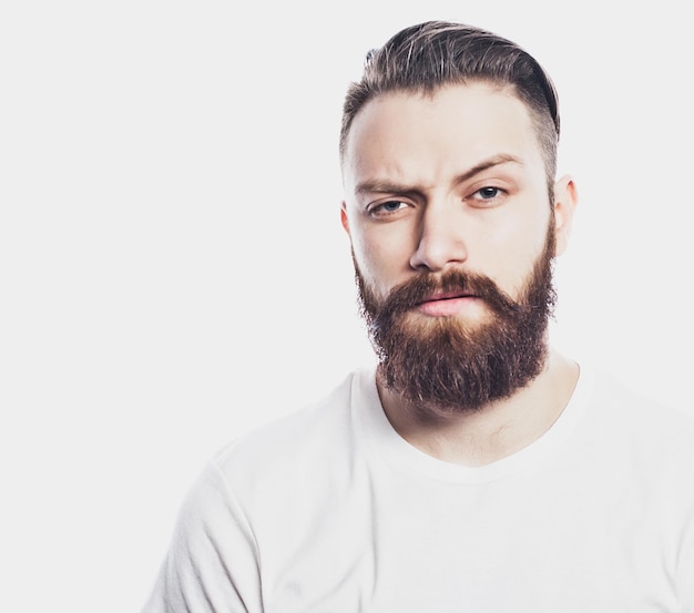 Young bearded man over white background Lifestyle and people concept