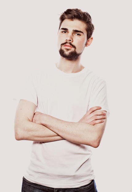 Young bearded man over white background