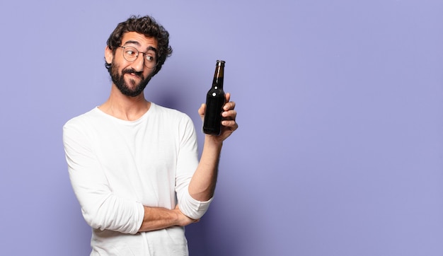 Young bearded man with a beer