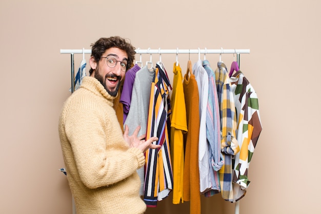 Young bearded man with clothes