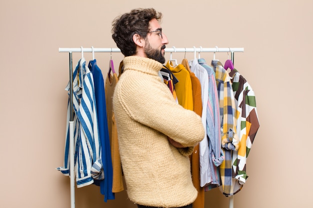 Young bearded man with clothes