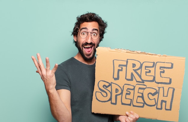 Young bearded man with free speech board