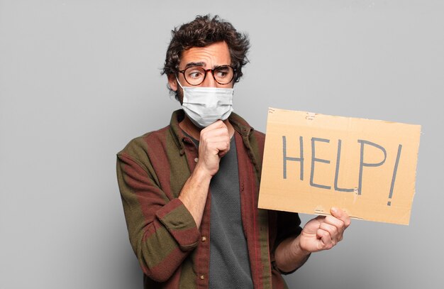 Young bearded man with a medical mask help concept