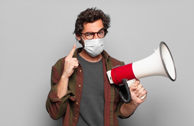 Young bearded man with a medical mask