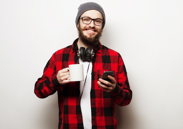 Young bearded man with mobile phone