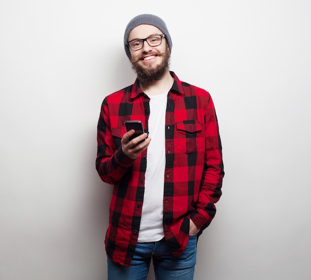 Young bearded man with mobile phone