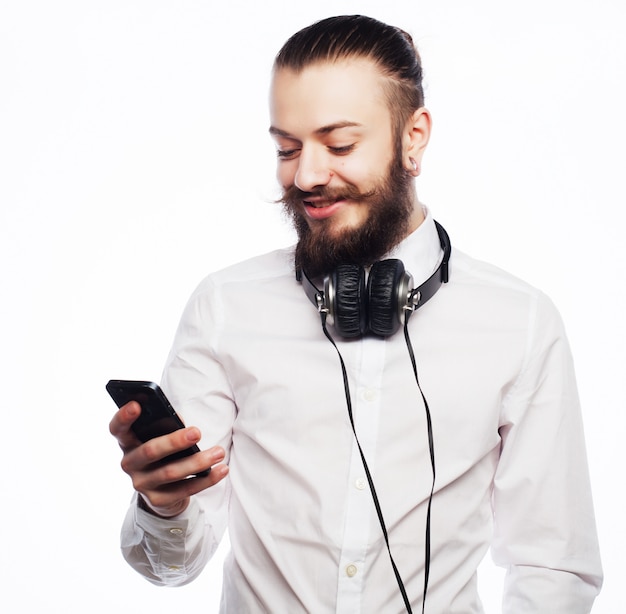 Young bearded man with mobile