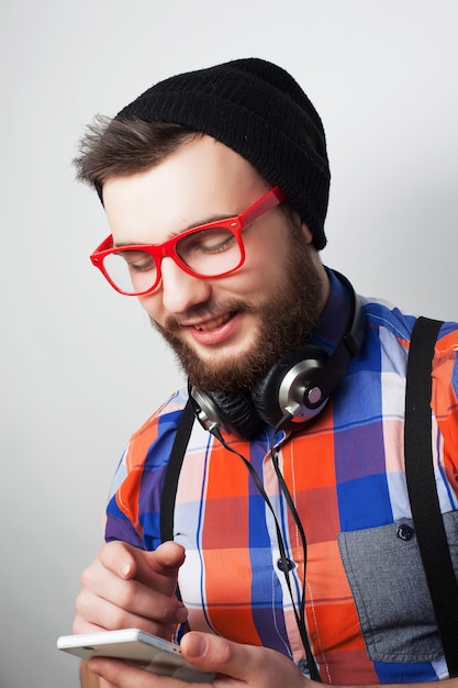 Young bearded man with  mobile