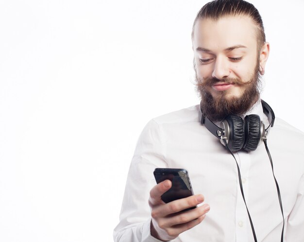 Young bearded man with mobile