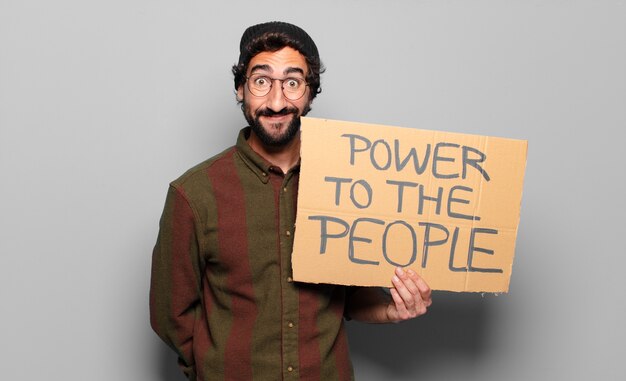 Young bearded man with power to the people banner