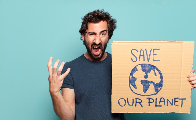 Young bearded man with save the world board