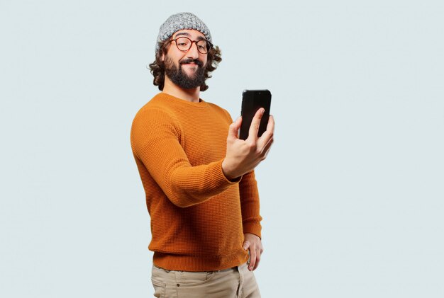 Photo young bearded man with a smart phone