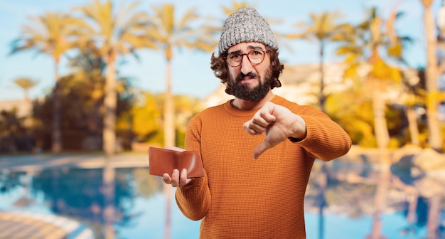 Young bearded man with a wallet